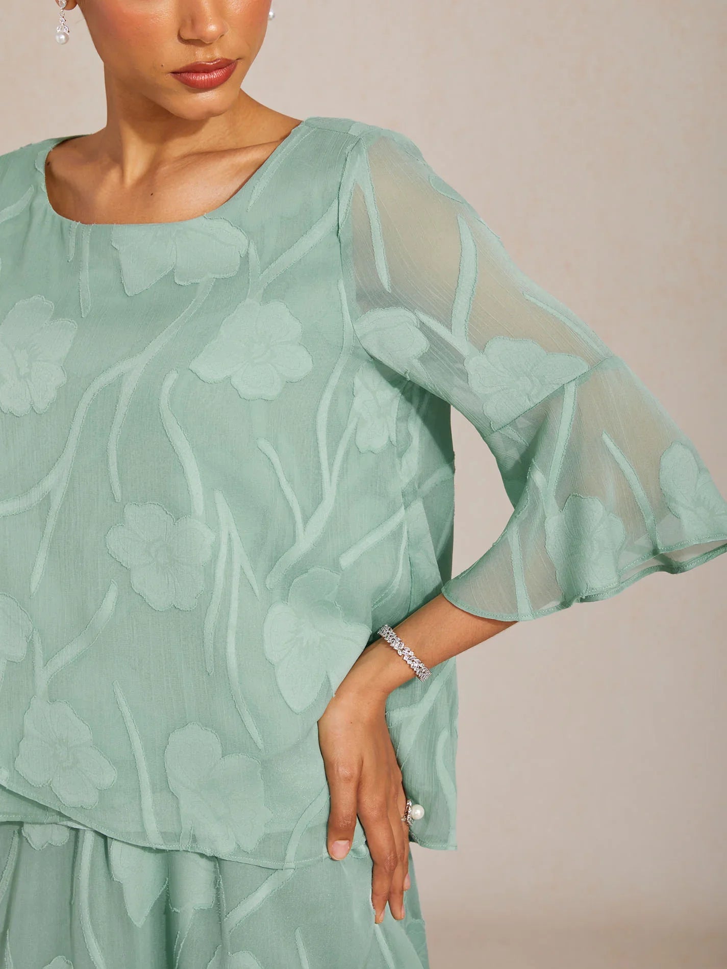 Elegant chiffon blouse with asymmetrical hem