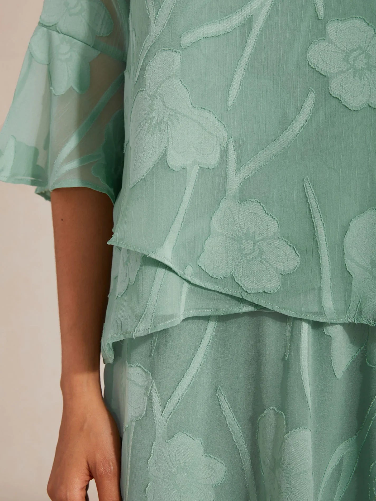 Elegant chiffon blouse with asymmetrical hem