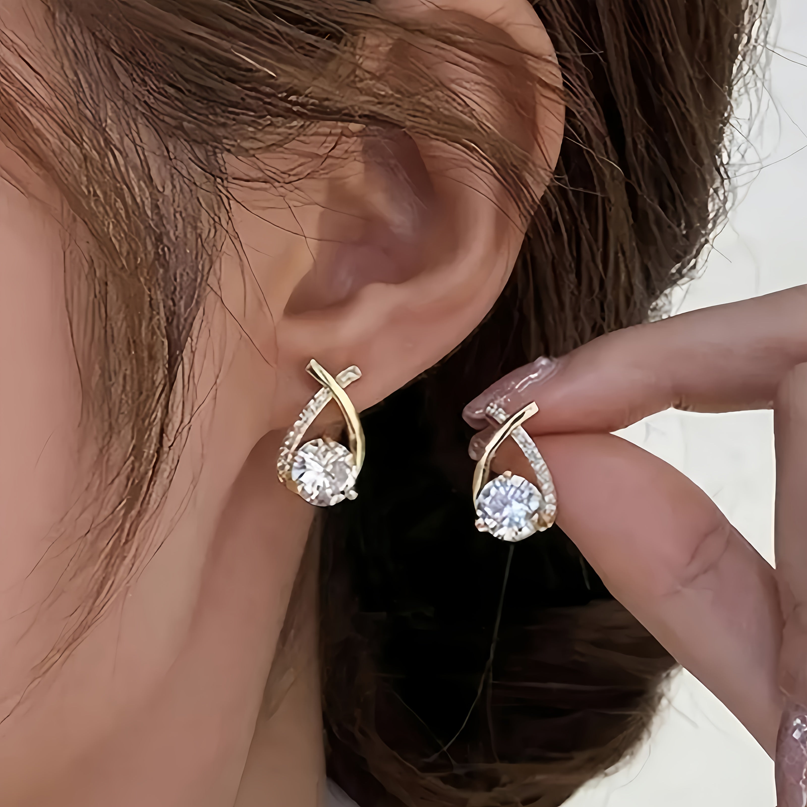 Pin earrings with a gold cross and zirconia