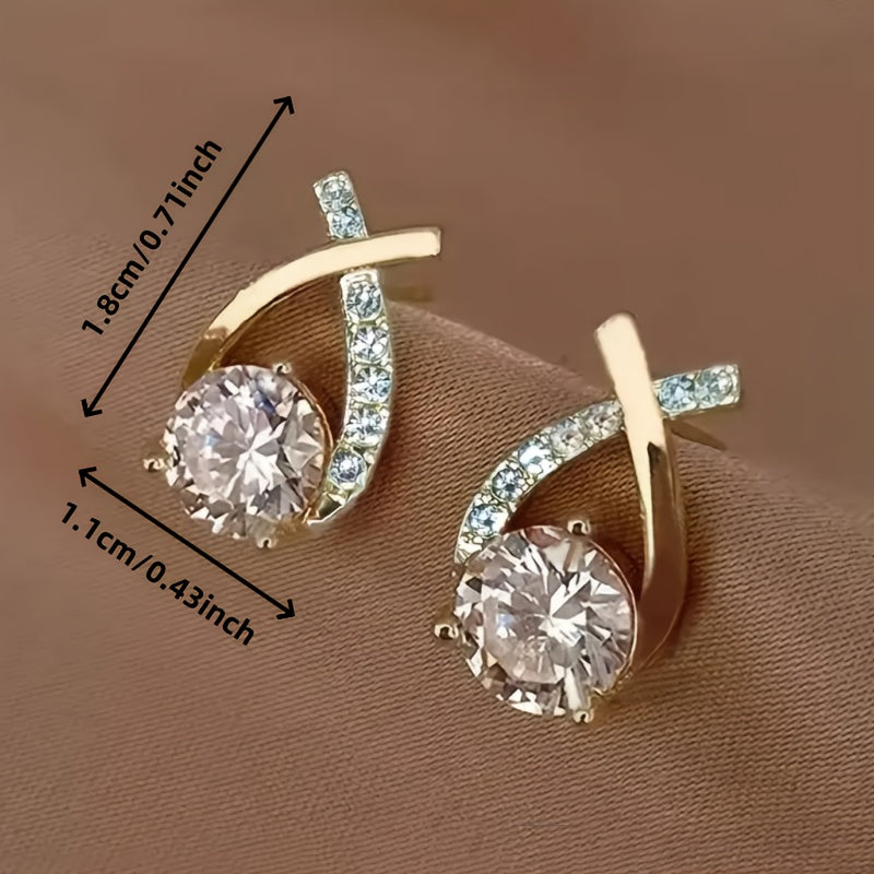 Pin earrings with a gold cross and zirconia