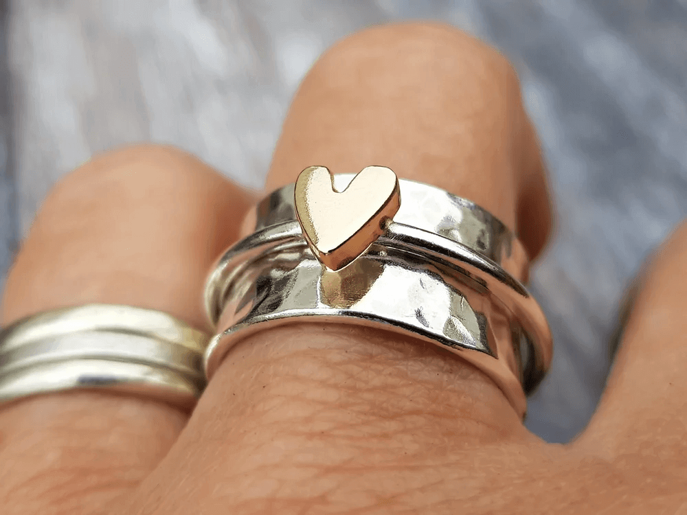 Silver ring with a gold heart
