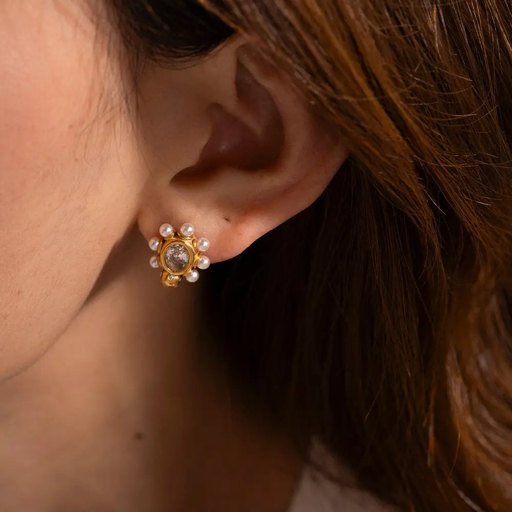 Designed gold earrings with pearl