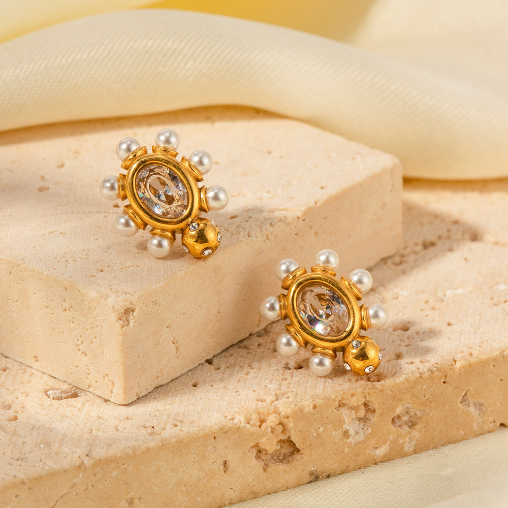 Designed gold earrings with pearl