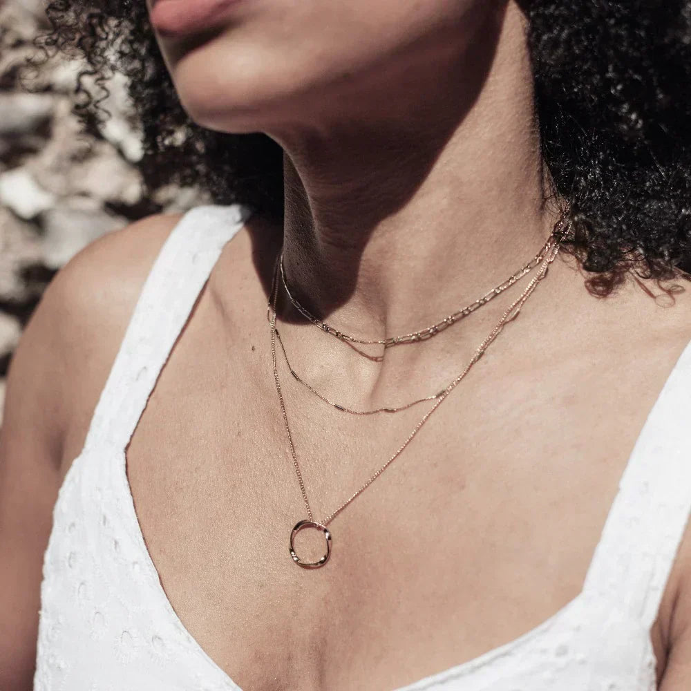 Open hoop bracelet in three rows of gold