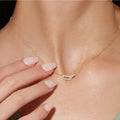 Elegant necklace with a wavy metallic flower pendant