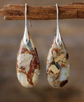 Chic Earrings with an Elliptical Stone
