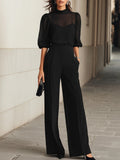 Valentina • A three-piece set in black, including a sheer camisole top and wide-leg pants