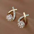 Pin earrings with a gold cross and zirconia
