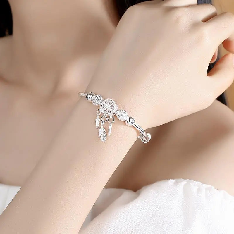 Silver bracelet with dream catcher pendant