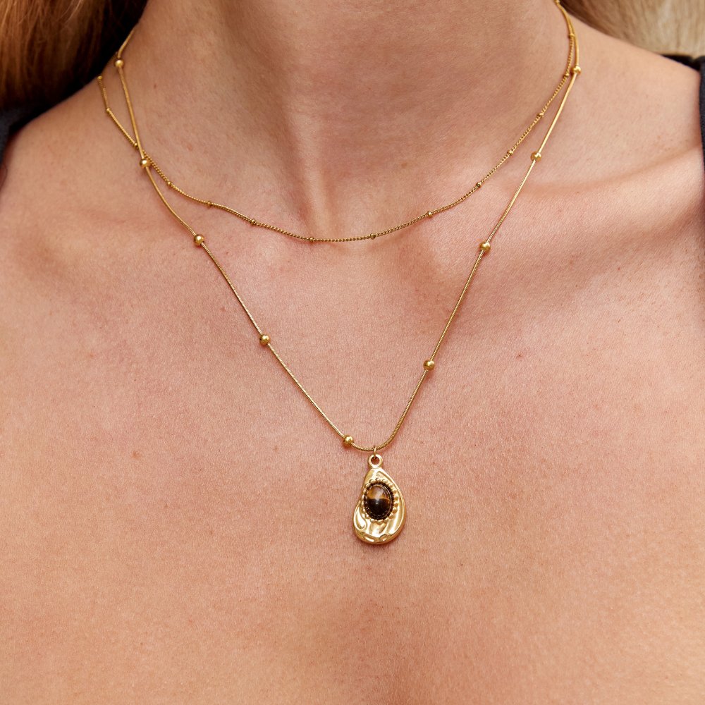 Elegant Gold Collar with Tiger Eye Stone
