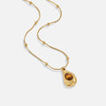 Elegant Gold Collar with Tiger Eye Stone